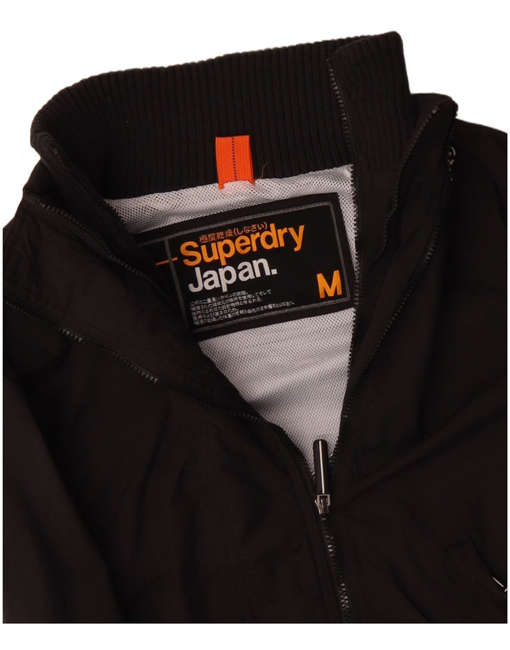 SUPERDRY ženska jakna vjetrovka UK 14 srednji crni poliester
