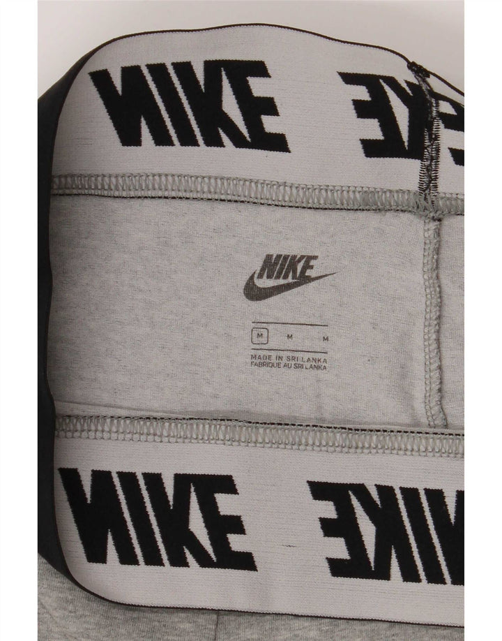 Nike ženske grafičke tajice UK 12 pamuk srednje sive boje