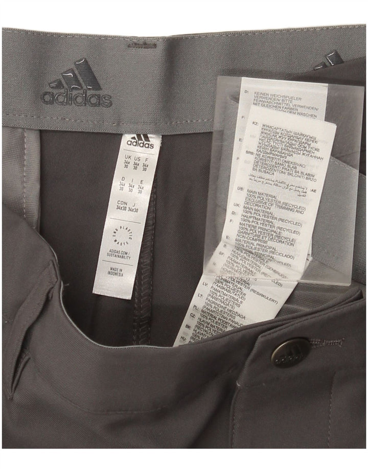 Adidas muške uske chino hlače W34 L30 sivi poliester