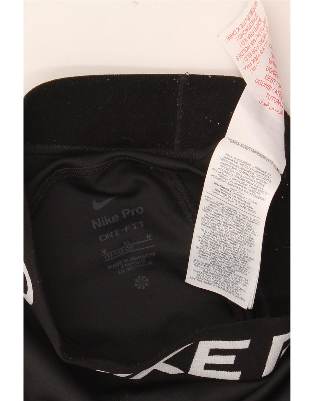 NIKE Girls Dri Fit Graphic Leggings 10-11 Years Medium Black Poliester