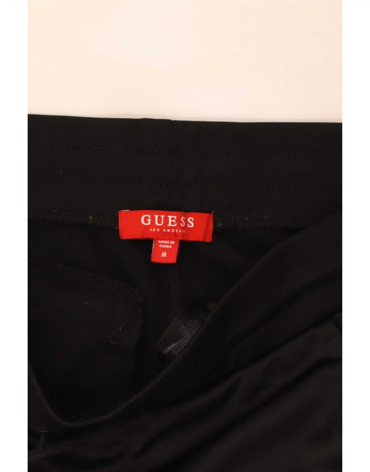 Muška trenirka Guess Graphic Hlače Joggers srednje crne boje