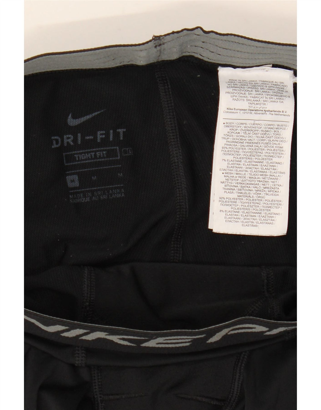 Nike muške pripijene grafičke tajice srednje crne boje od poliestera