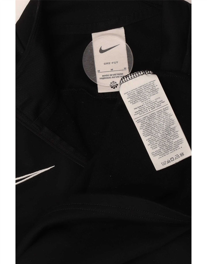 Nike Dri Fit majica s izrezom na patent i gornji dio trenirke srednje crne boje