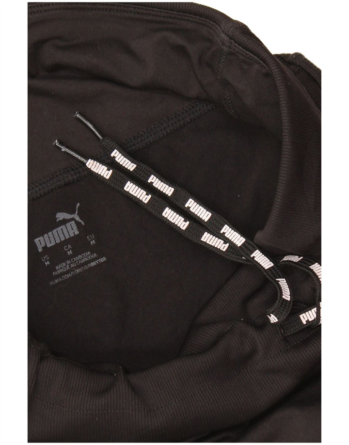 PUMA Ženska trenirka Hlače Joggers UK 12 srednje crne