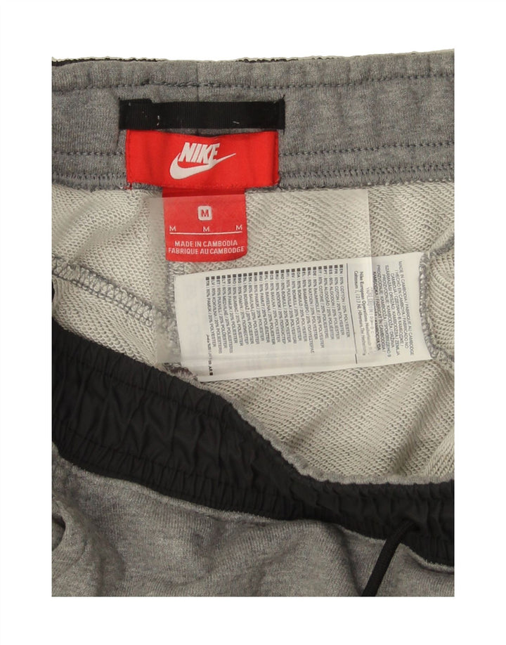 NIKE Mens Tracksuit Trousers Joggers Medium Grey Cotton Vintage Nike and Second-Hand Nike from Messina Hembry 