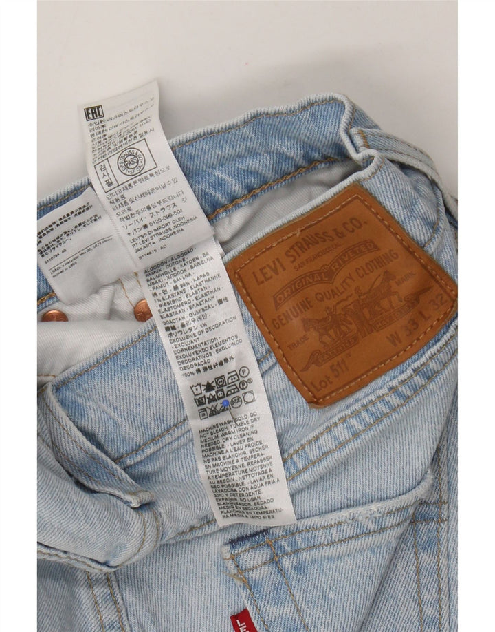 Levi's ženske 511 uske traperice s oštećenim izgledom W33 L32 plavi patchwork pamuk