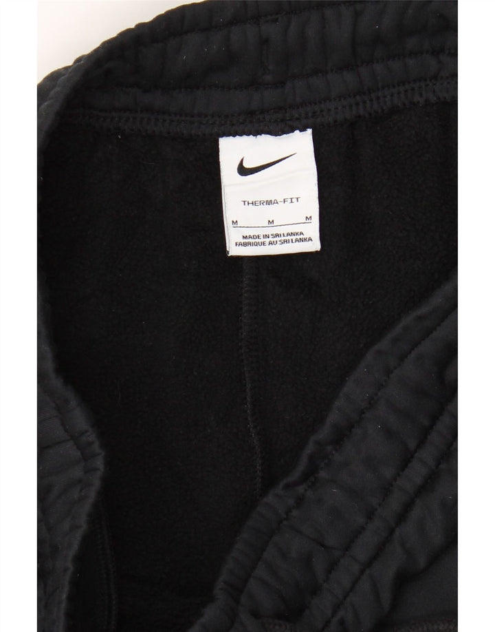 NIKE Mens Therma-Fit Graphic Tracksuit Trousers Medium  Black Vintage Nike and Second-Hand Nike from Messina Hembry 