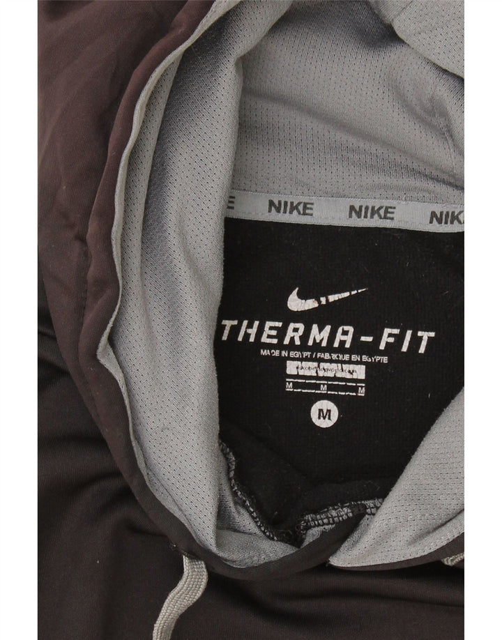 NIKE Mens Therma-Fit Hoodie Jumper Medium Black Colourblock Polyester Vintage Nike and Second-Hand Nike from Messina Hembry 