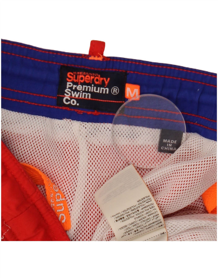 Superdry muške kratke hlače za kupanje s grafičkim motivima srednje crvene boje od poliestera