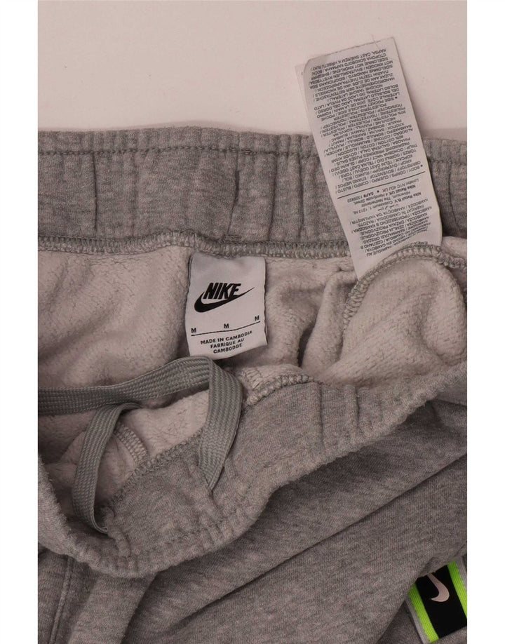 Nike muške grafičke kargo trenirke hlače za trčanje srednje sive boje