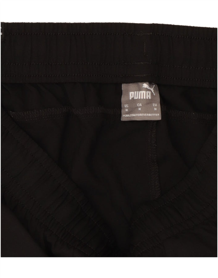 Puma Ženska trenirka Hlače Joggers UK 14 srednje crni poliester