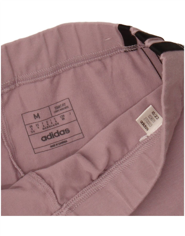 ADIDAS ženske uske trenirke hlače UK 12/14 srednje ružičaste boje