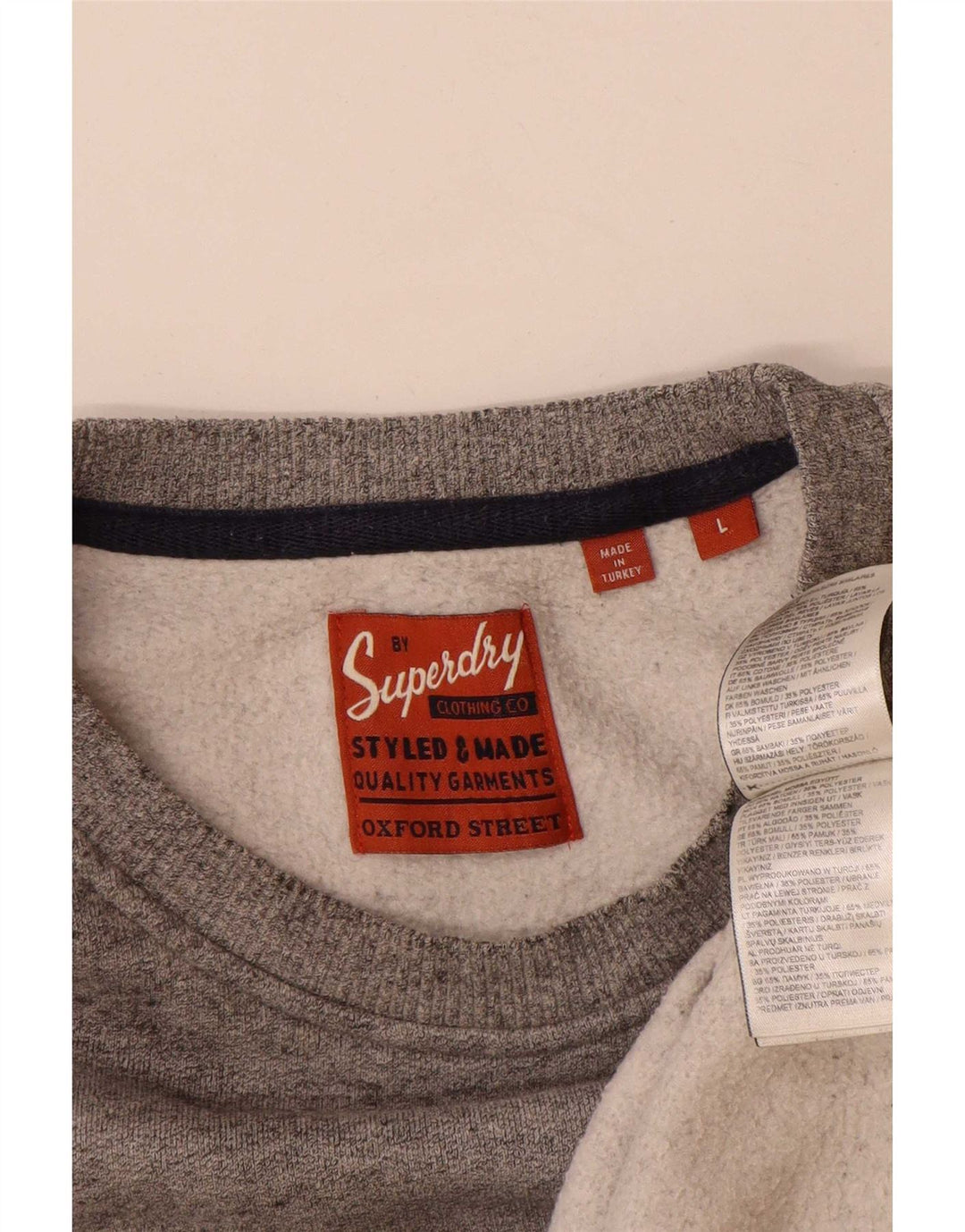 Superdry muški džemper s grafičkim motivima, veliki sivi flekasti pamuk