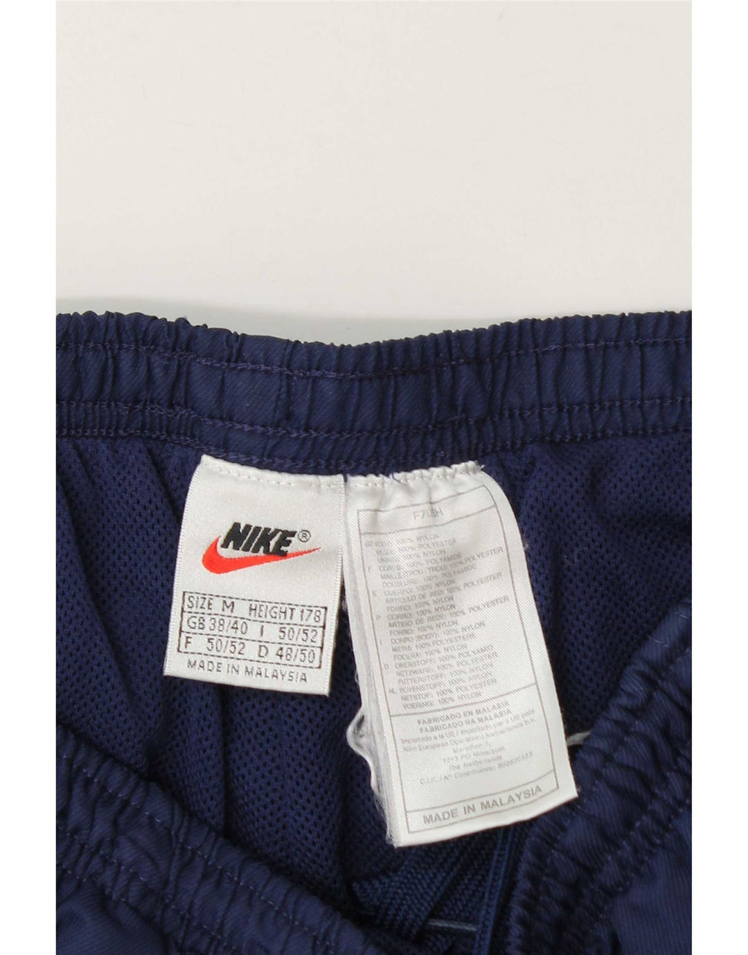 Nike muške hlače za trenirku UK 38/40 srednje tamnoplave najlonske hlače