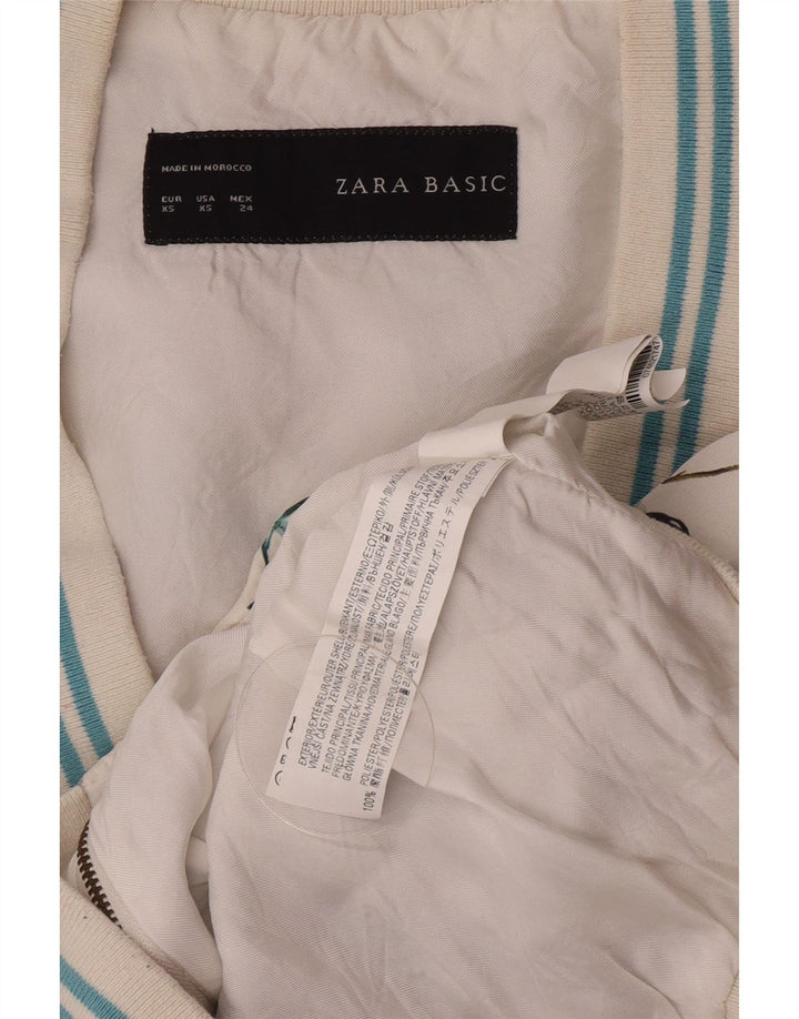 Ženska bomber jakna Zara Graphic UK 6 XS bijeli cvjetni poliester