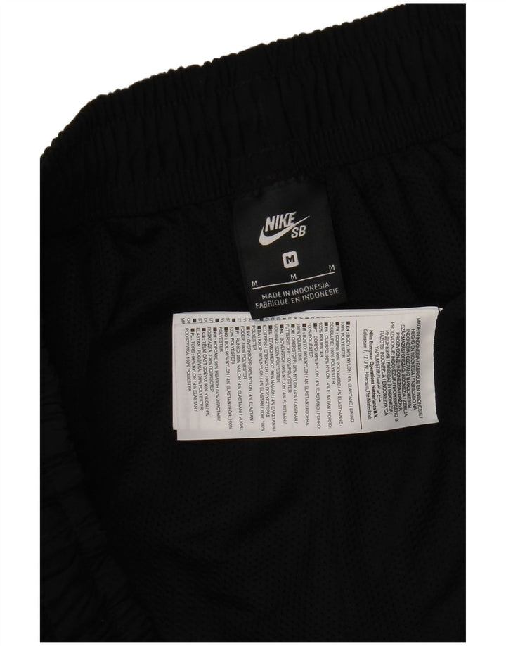 Nike muške trenirke, srednje crne najlonske hlače