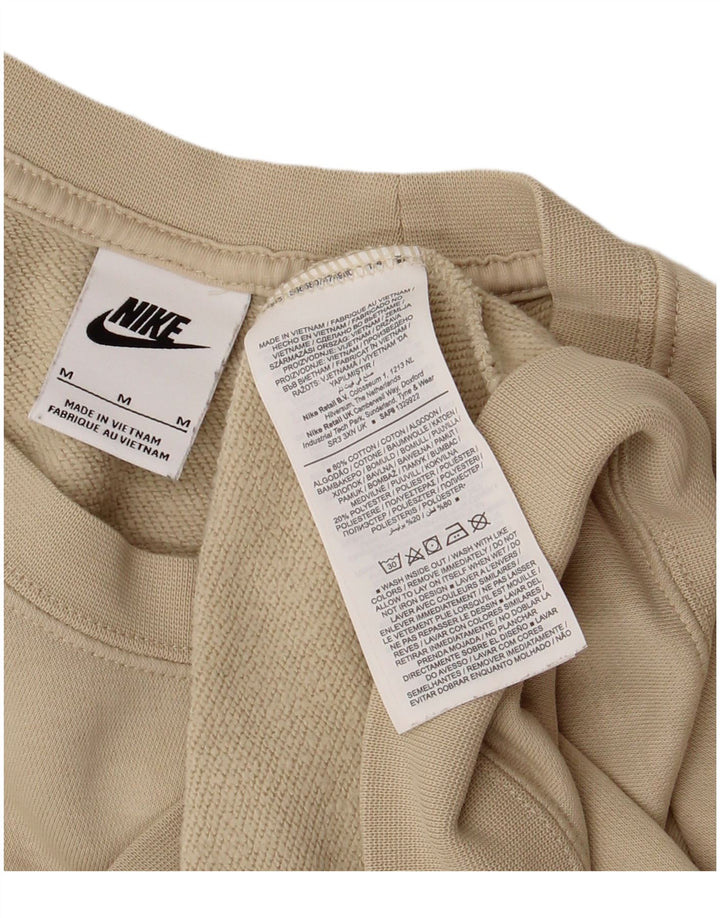 Nike Ženska prekomjerna trenirka s grafičkim motivima UK 14 srednje bež pamuk