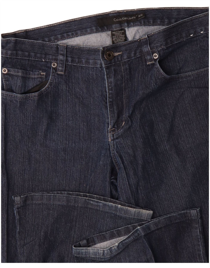 Ženske traperice Calvin Klein Bootcut US 12 Large W34 L31 tamnoplavi pamuk