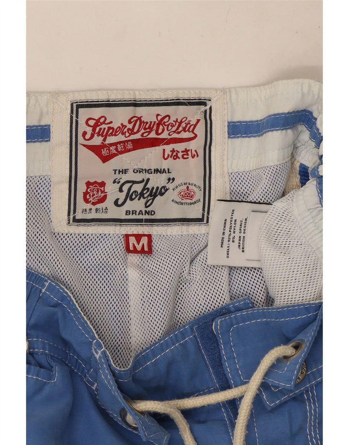 Superdry muške kratke hlače za kupanje s grafičkim motivima srednje plavi poliester