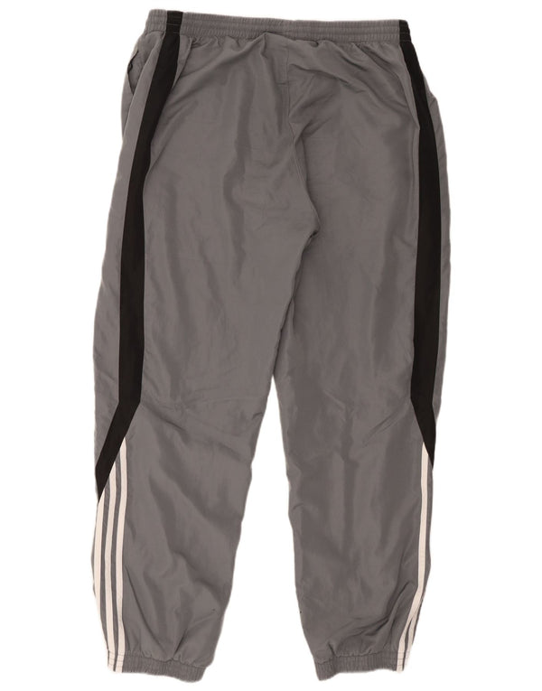 Adidas muške trenirke Hlače Joggers XL sivi poliester u boji