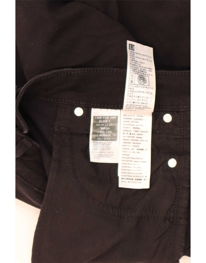 Levi's ženske 712 uske traperice W26 L30 crni pamuk