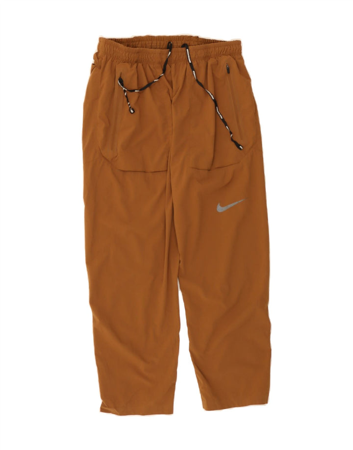 NIKE Girls Dri Fit Tracksuit Trousers 10-11 Years Medium Brown Polyester Vintage Nike and Second-Hand Nike from Messina Hembry 