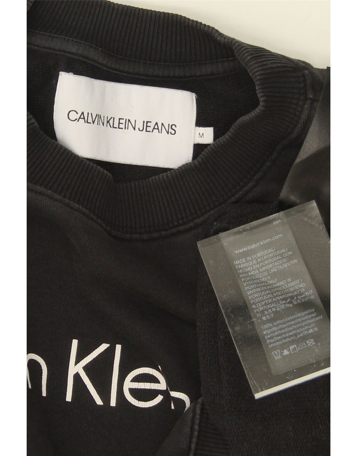 CALVIN KLEIN JEANS Mens Graphic Sweatshirt Jumper Medium Black Cotton Vintage Calvin Klein Jeans and Second-Hand Calvin Klein Jeans from Messina Hembry 
