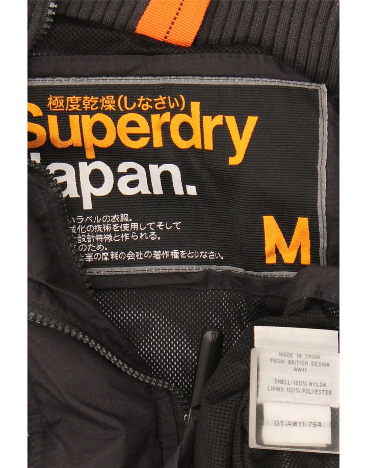 Superdry ženska kišna jakna s grafičkim motivima UK 14 Srednje crni najlon