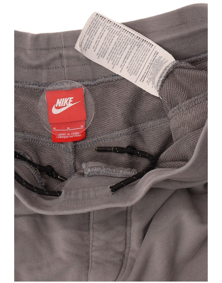 Nike muške grafičke trenirke, hlače za trčanje srednje sive boje