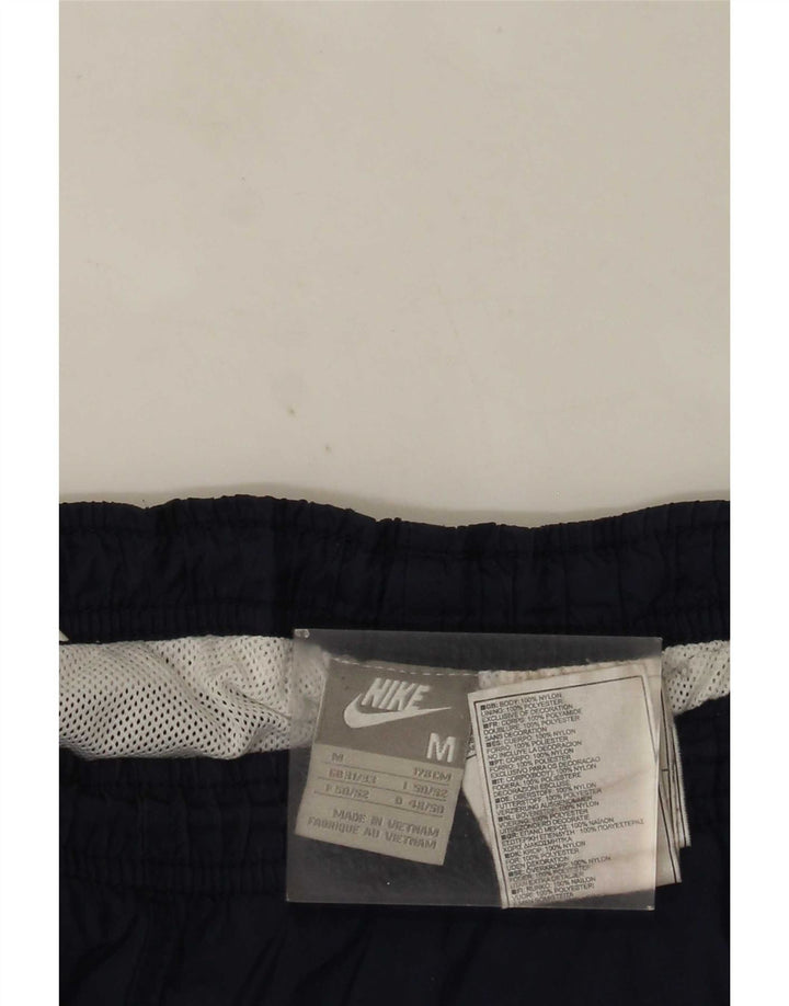 Nike muške trenirke srednje tamnoplave najlonske hlače