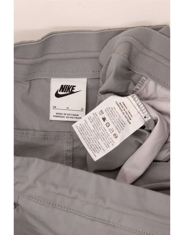 Nike muške ravne kargo hlače W34 L28 sivi pamuk