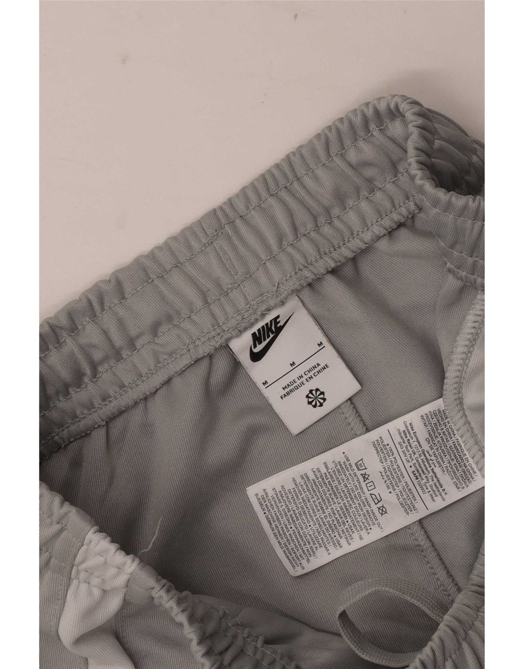 Nike muške grafičke trenirke, hlače za trčanje srednje sive boje