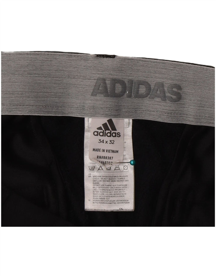 Adidas muške uske chino hlače W34 L32 crni poliester