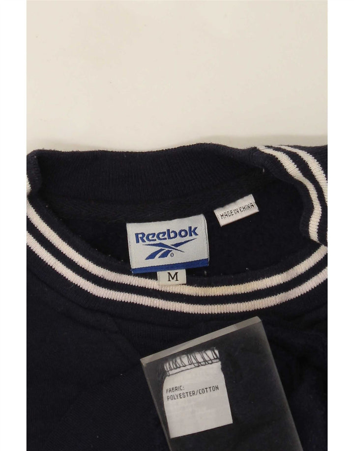 Reebok muška trenirka s grafičkim motivima Srednji tamnoplavi poliester