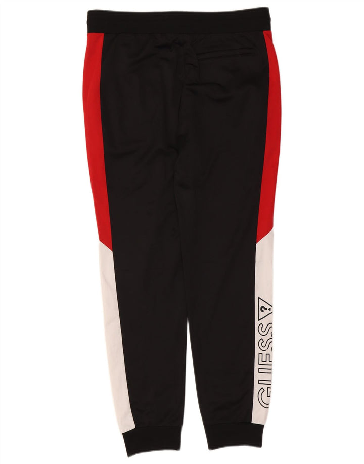 Muška trenirka Guess Graphic Hlače Joggers srednje crne boje