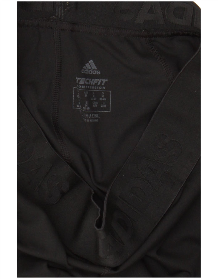 Adidas ženske grafičke tajice UK 12/14 srednje crne