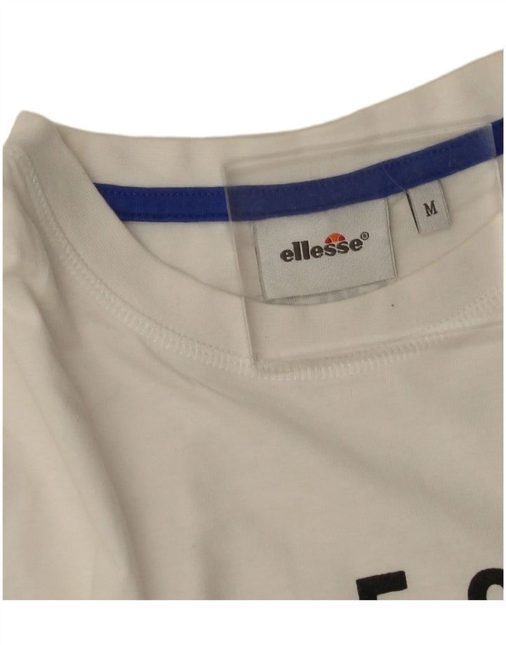 Ellesse Ženska majica kratkih rukava s grafičkim motivima UK 14 Srednje bijeli pamuk