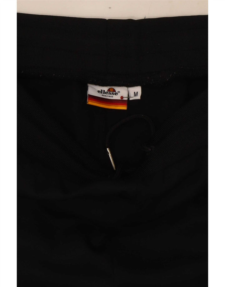 Ellesse muške grafičke trenirke hlače srednje crne boje, pamuk