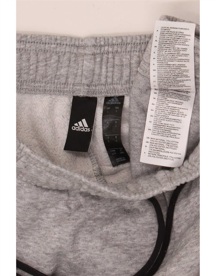 Adidas velike sive pamučne trenirke s grafičkim motivima