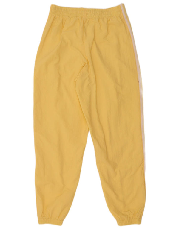 Adidas ženske hlače za trenirku s grafičkim motivima Joggers UK 12 srednje žute boje