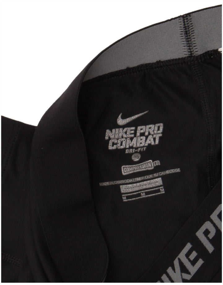 Nike Ženske Dri Fit Graphic Capri tajice UK 12 srednje crne