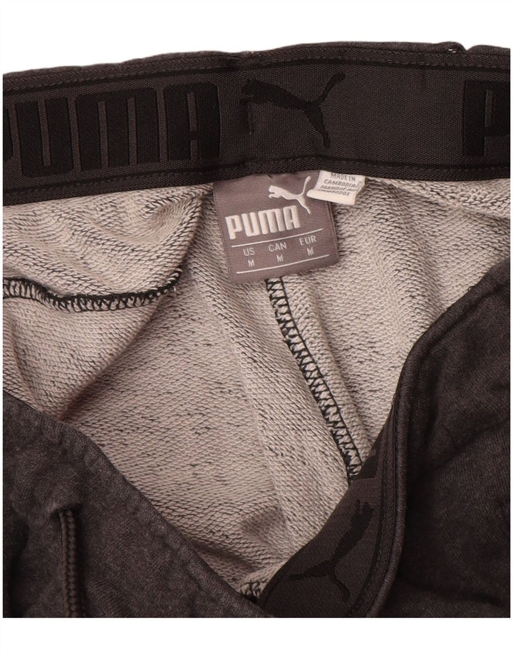 PUMA Muška trenirka Hlače Joggers srednje sive