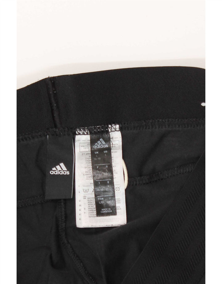 Adidas ženske tajice UK 16/18 velike crne