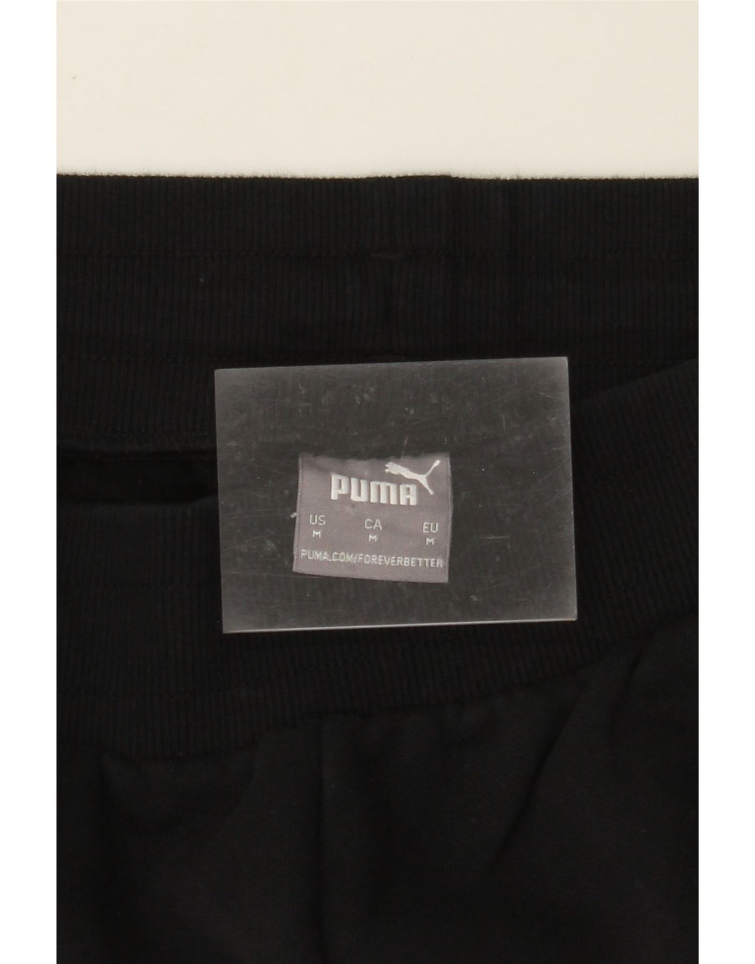 PUMA Ženska trenirka Hlače Joggers UK 12 srednje crne