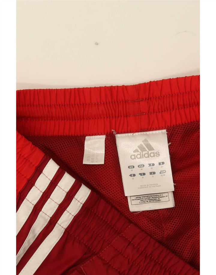 Adidas muške trenirke hlače Joggers srednje crvene boje od poliestera