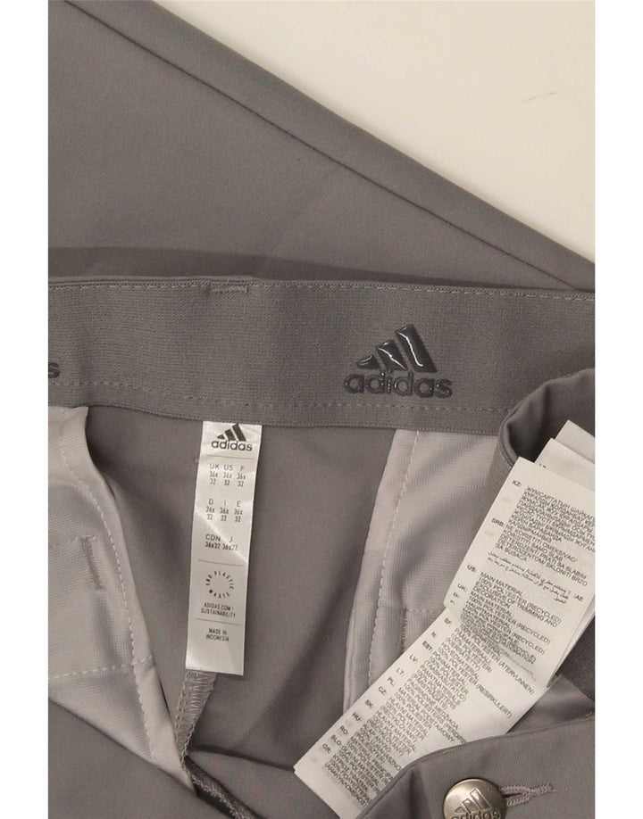 Adidas muške uske chino hlače W36 L32 sivi poliester