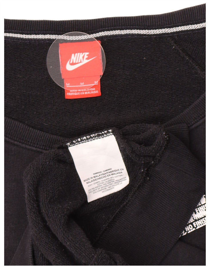 Nike Ženska prekomjerna trenirka s grafičkim motivima UK 14 Srednje crni pamuk