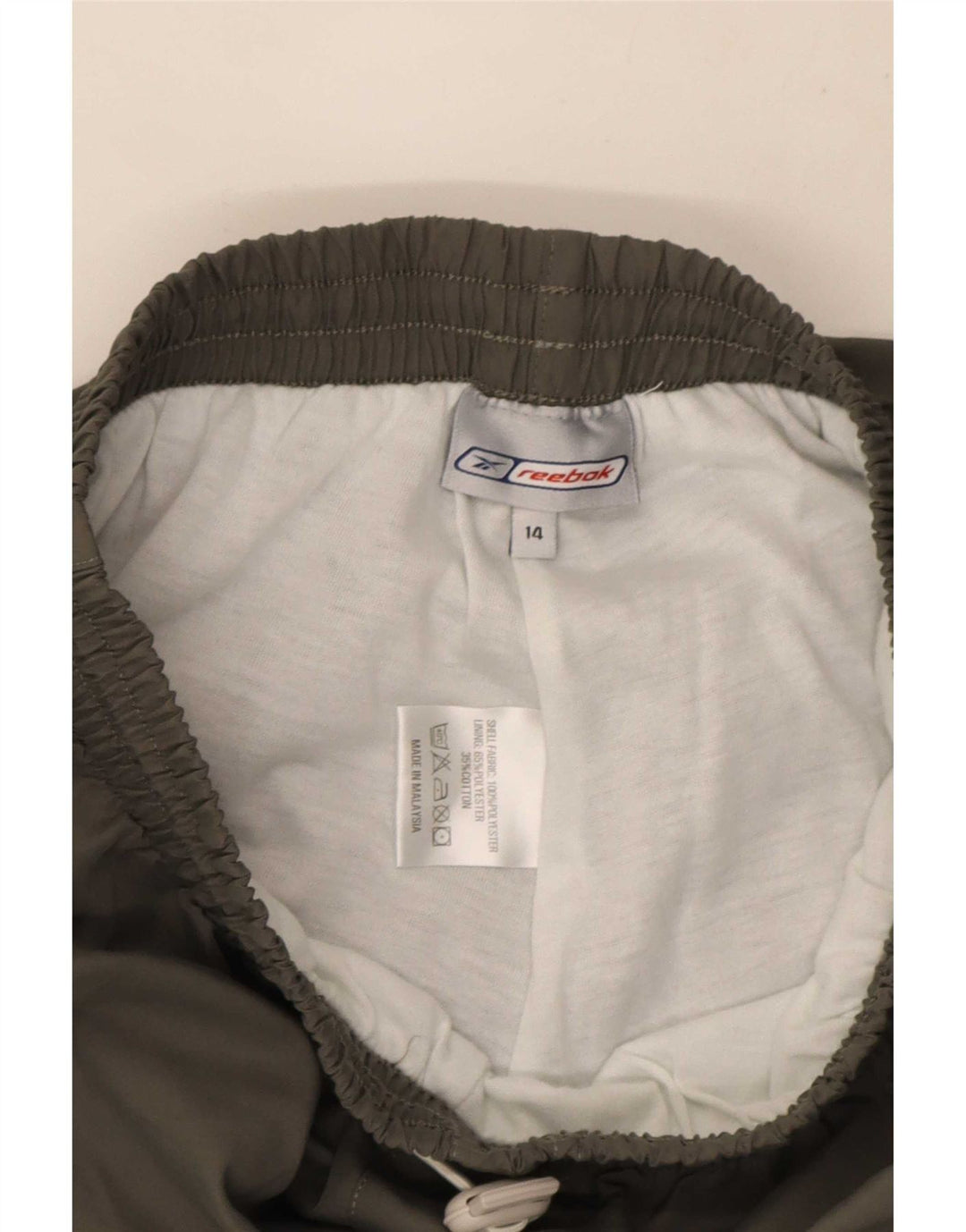 Hlače Reebok Trenirka za dječake 13-14 godina Kaki poliester