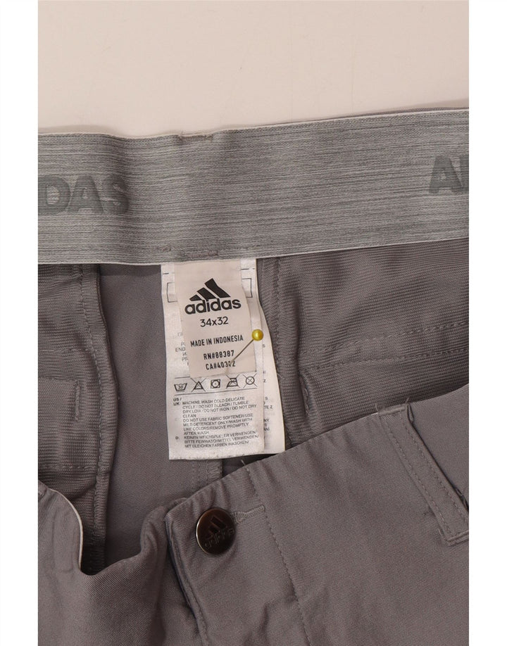 Adidas muške uske chino hlače W34 L32 sivi poliester
