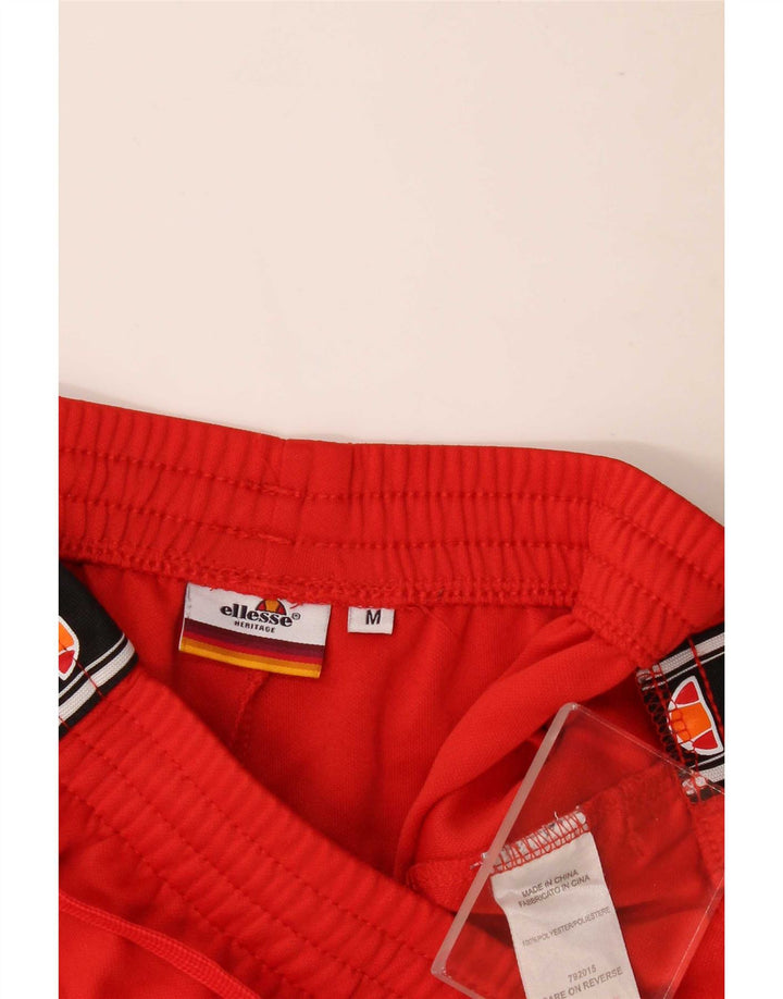 Ellesse muške grafičke trenirke hlače srednje crvene boje od poliestera